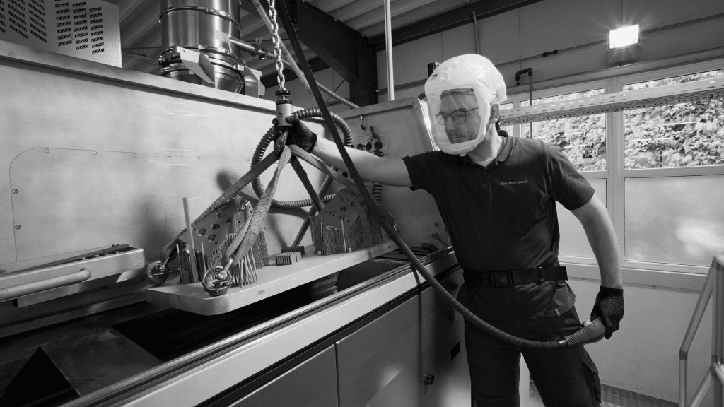 An engineer examining a freshly printed REEN component in the workshop