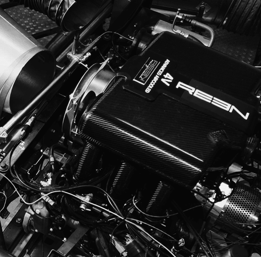 The REEN aircooled 4-cam engine under test, carbon intake cover branded REEN